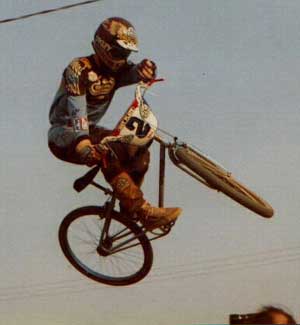 This was a jump in the second turn at Kings BMX in Modesto.. The head in the bottom of the shot is Sandy Finkleman, Owner of Wheels and Things , and Team Manager of Diamond Back at the time; 1982